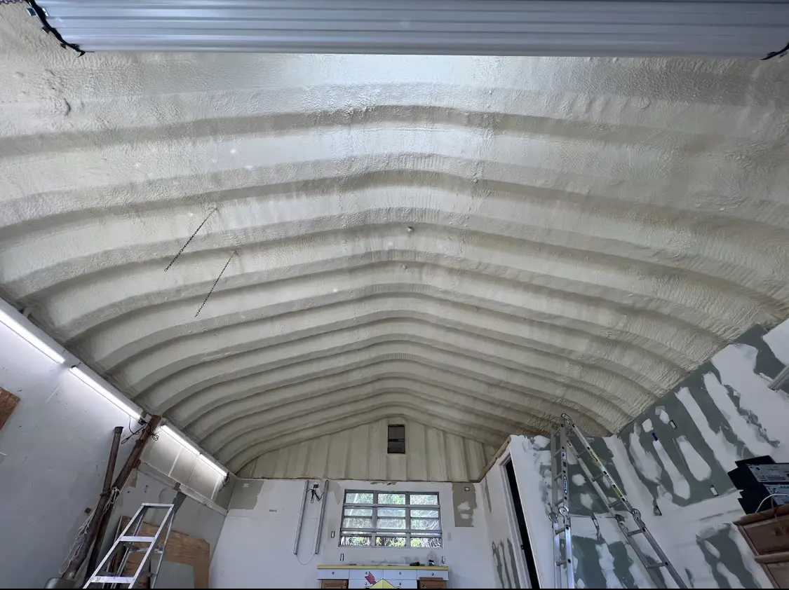 Spray polyurethane foam applied to the underside of a metal roof deck in Sylacauga